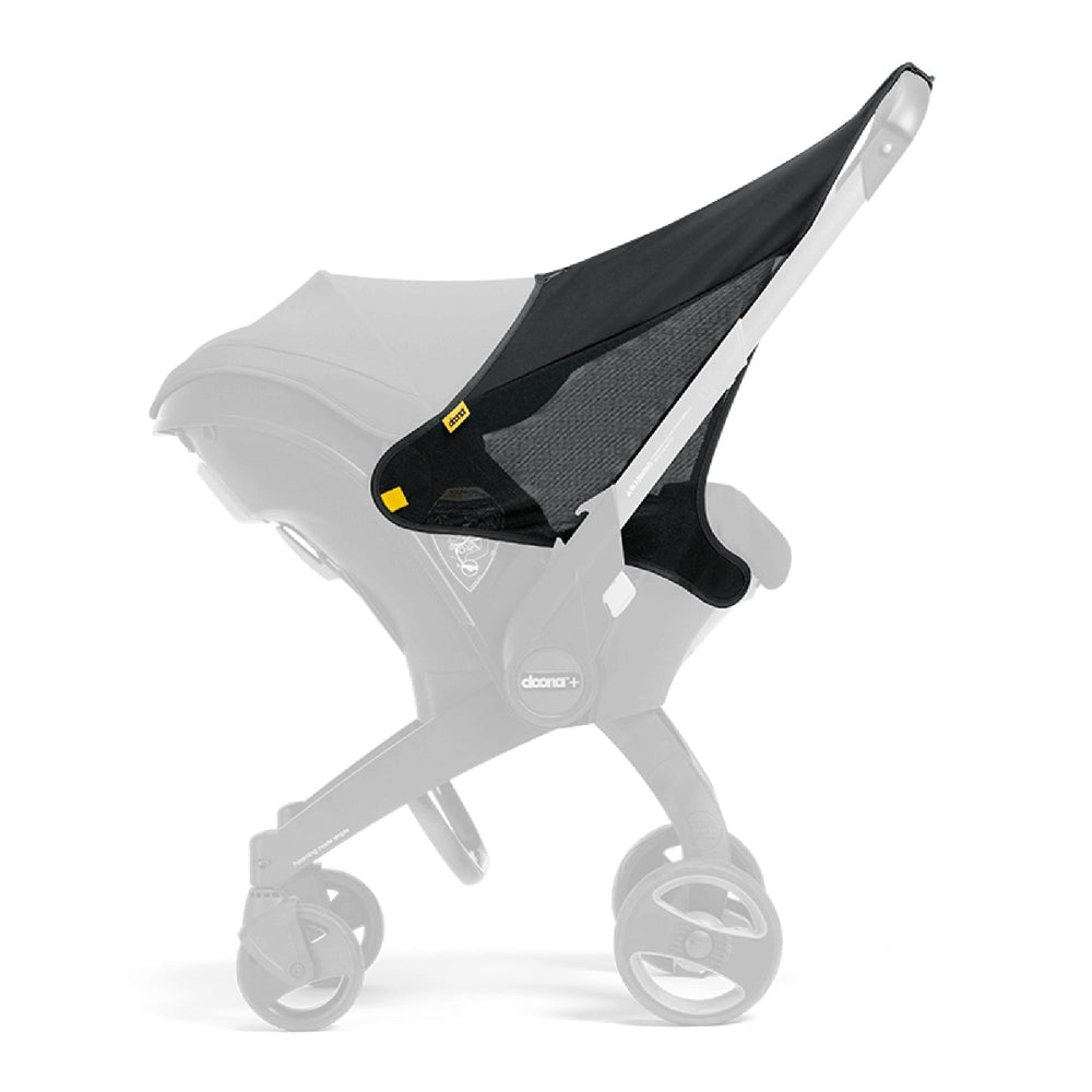 DOONA Sunshade Extension attached to a car seat for shade.
