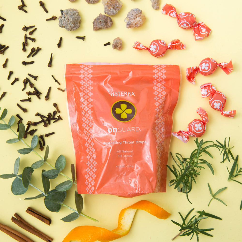 Lifestyle shot suggesting a daily wellness routine with doTERRA On Guard throat drops.
