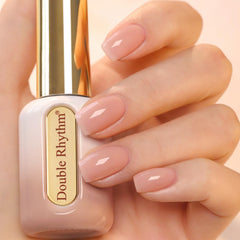 Double Rhythm gel polish bottle with golden round cap showing premium design for at-home manicures