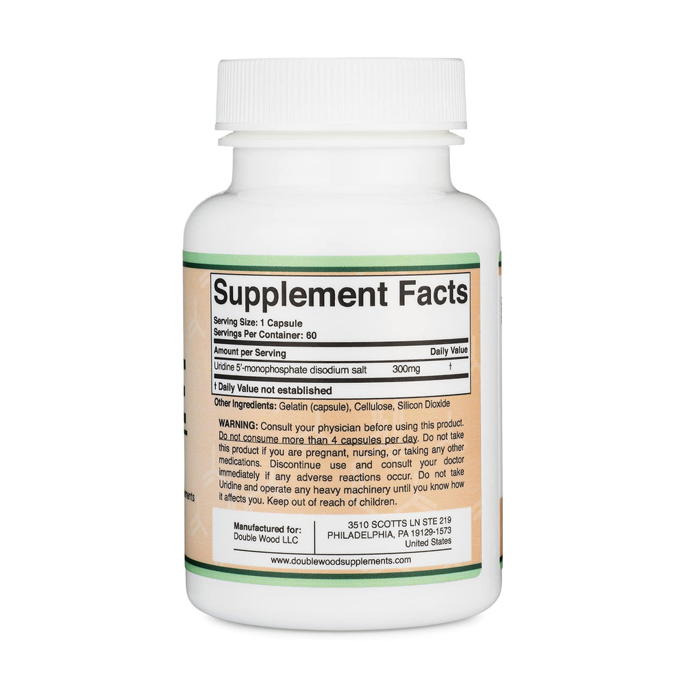 Double Wood Uridine Monophosphate capsules poured for easy daily use