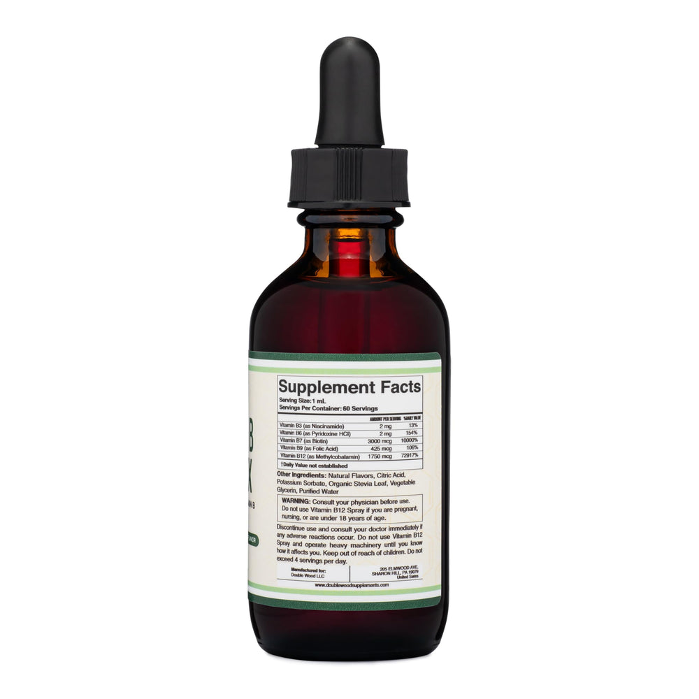 Double Wood liquid B complex drops being poured for easy daily use.