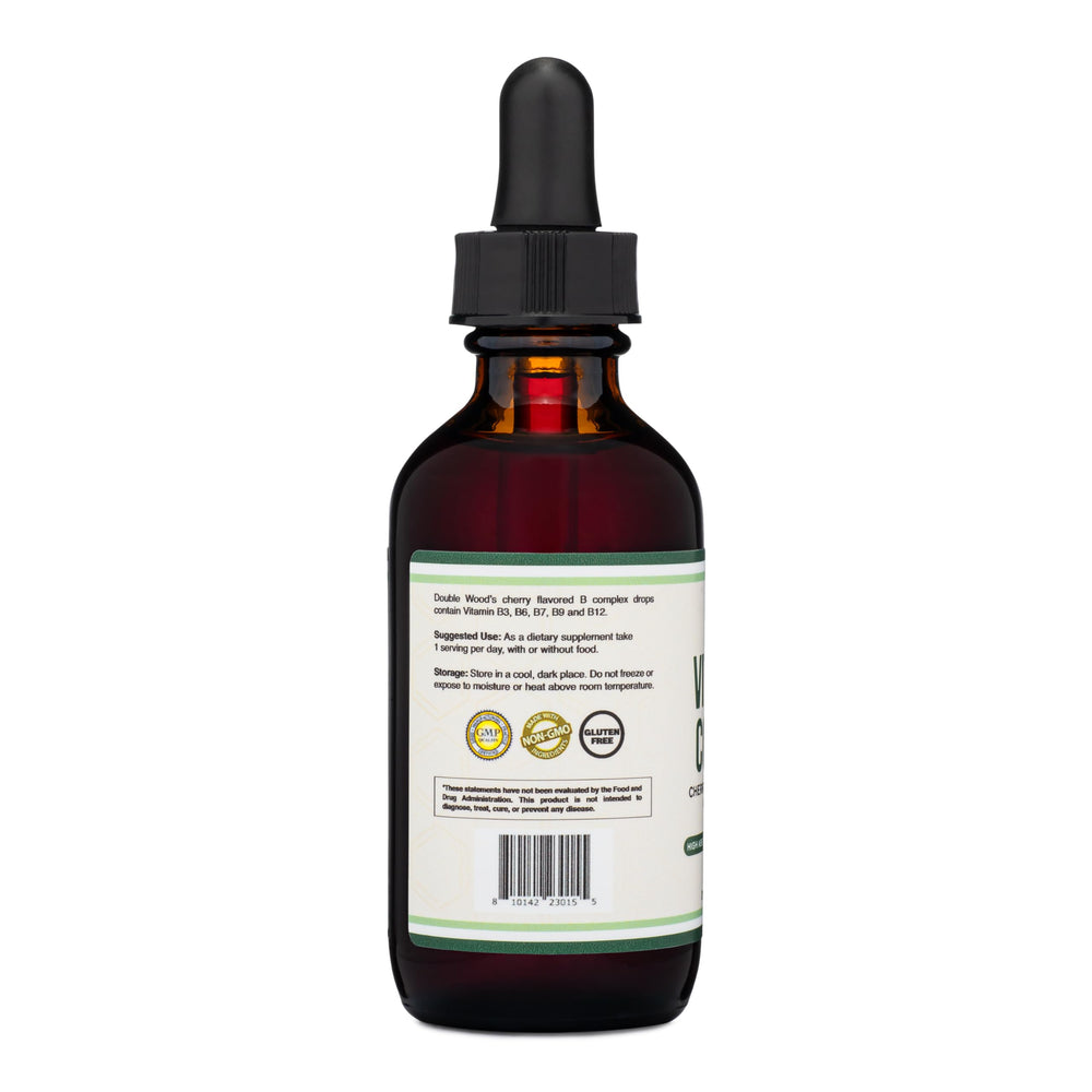 Lifestyle shot of a person taking Double Wood B complex drops as part of daily routine.