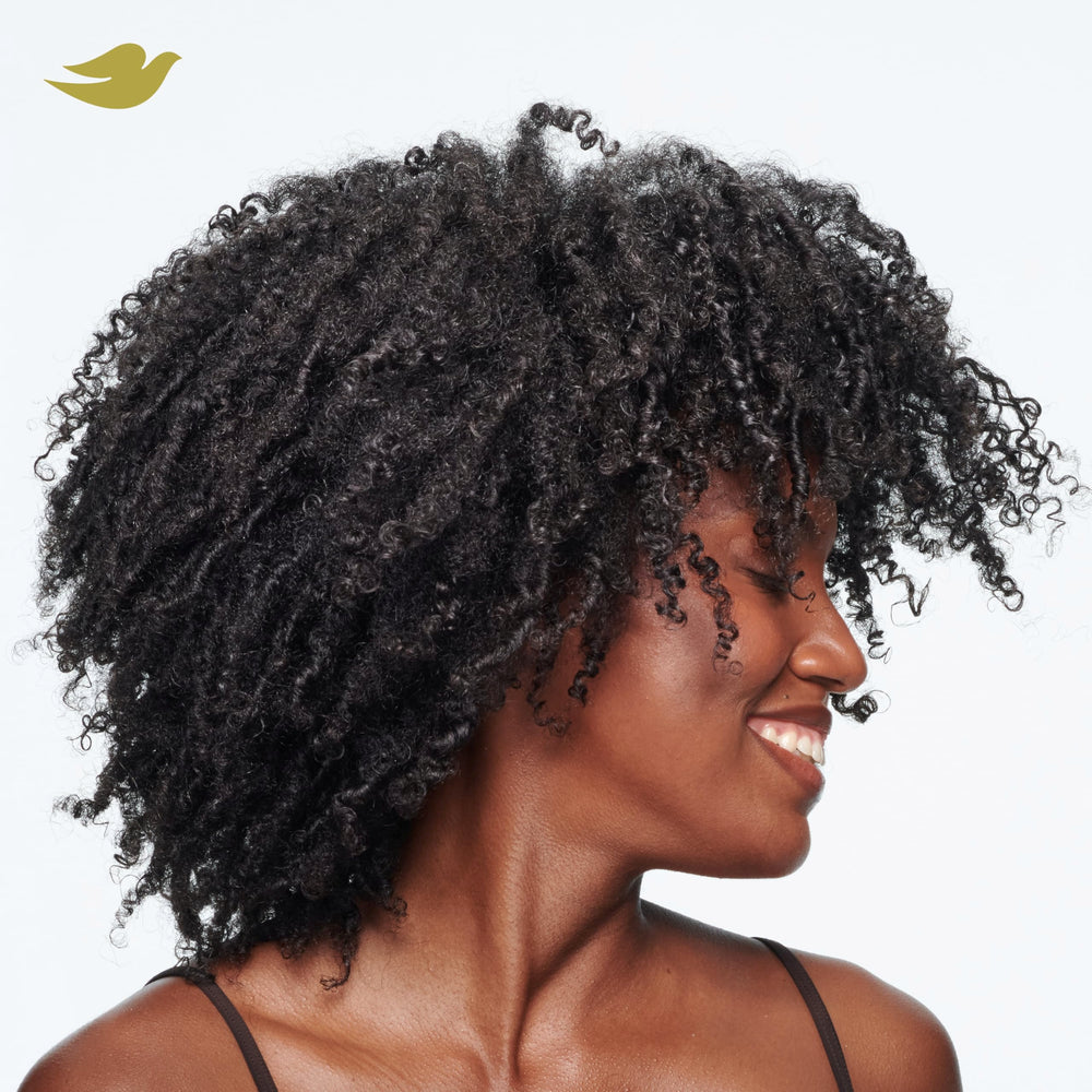 Dove Amino Curl Cream ingredient panel highlights Amino Complex.