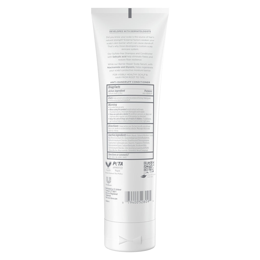 Dove Derma Scalp Conditioner being applied to scalp for gentle flake removal