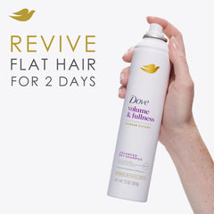 Dove Advanced Dry Shampoo being sprayed near roots for volumizing refresh.
