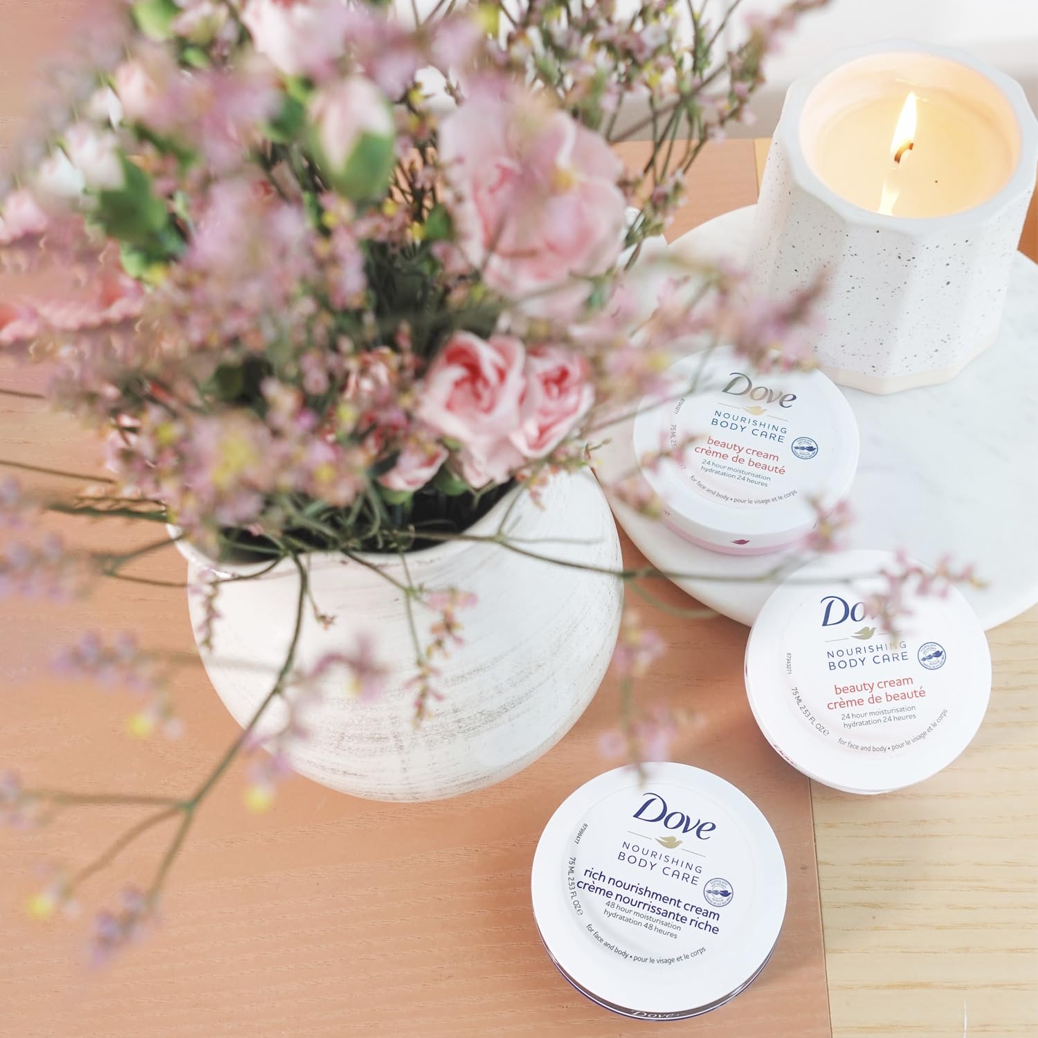 Hands apply Dove Lotion for quick absorption and moisturized feel.