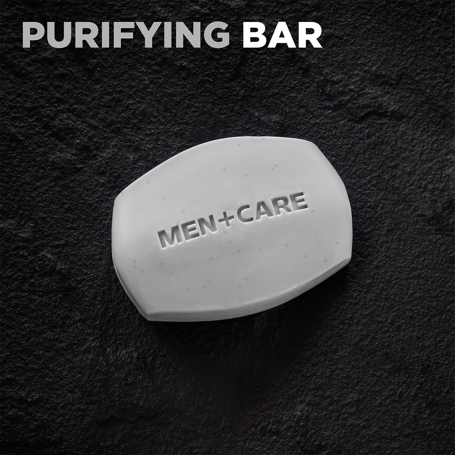 Dove Men+Care charcoal bar used on body, face, and shaving prep.