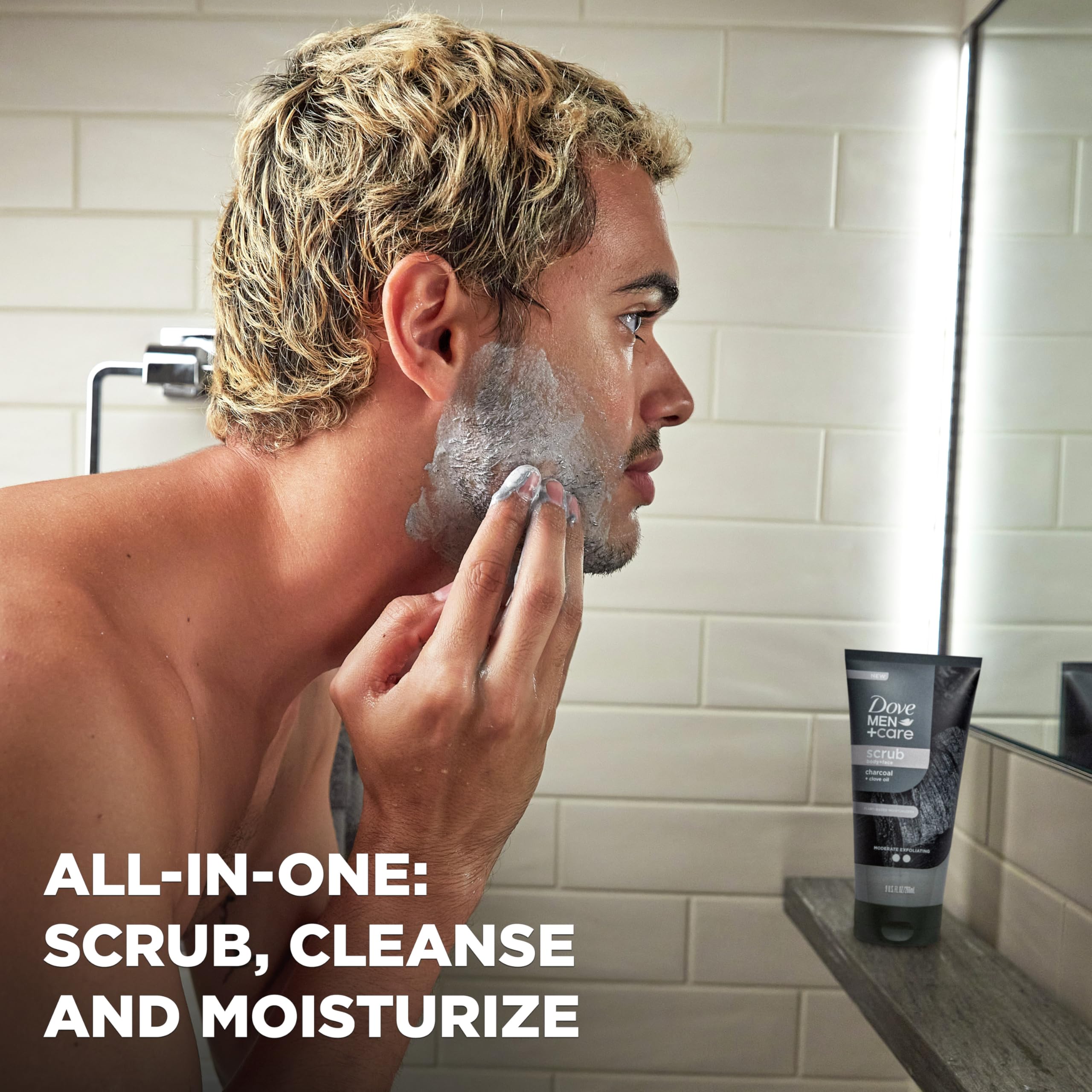 Dove Men+Care charcoal clove scrub creating a cleansing lather and rinse.