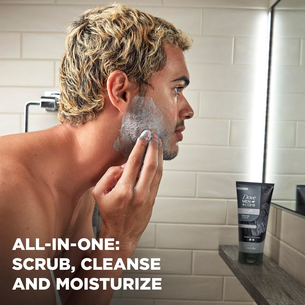 Dove Men+Care charcoal clove scrub creating a cleansing lather and rinse.