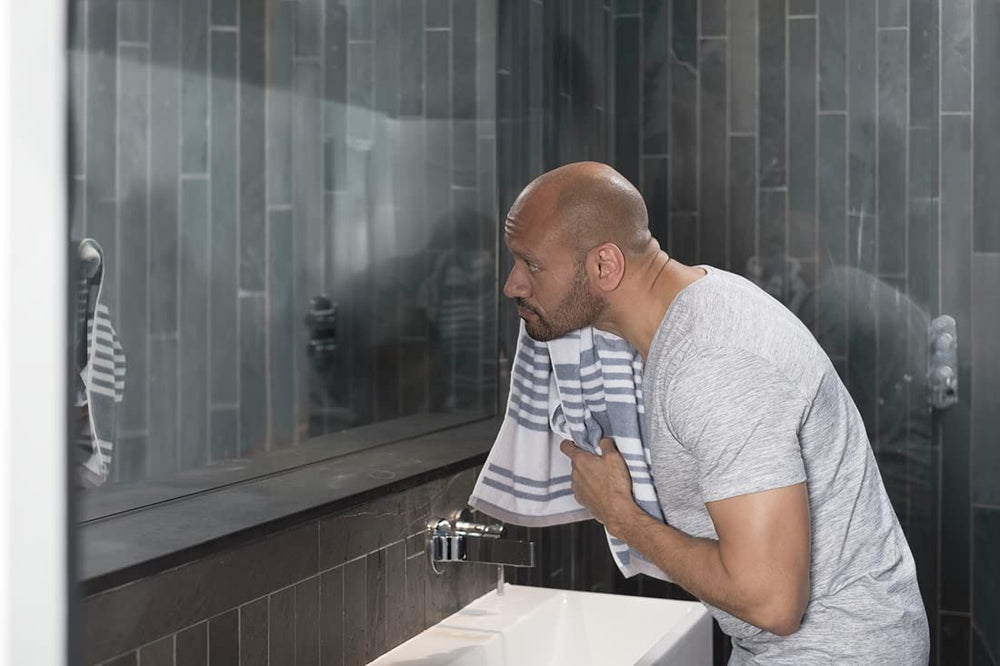 Dove Men+Care Hydrate Face Wash water rinse demo highlights clean feel after washing.