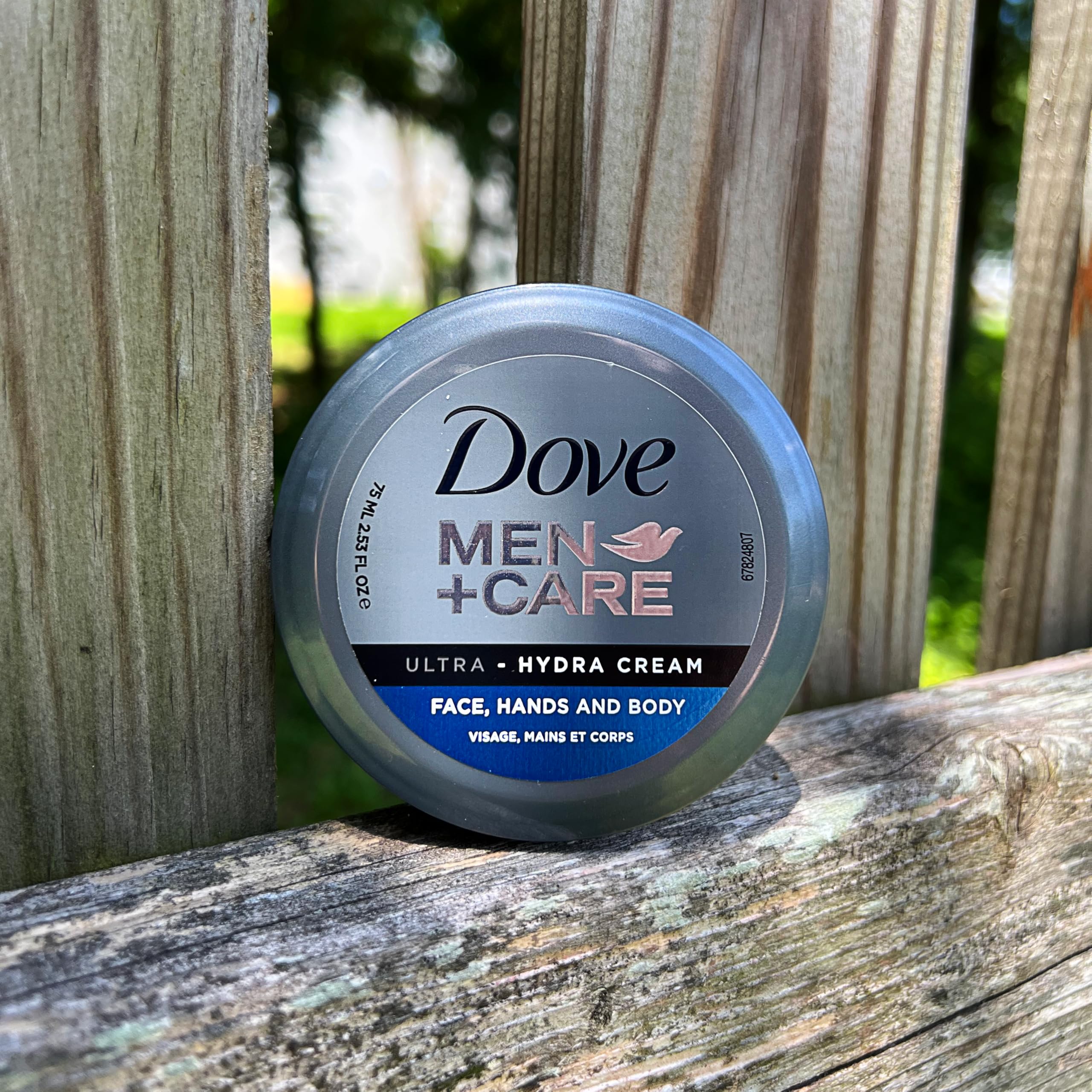 Dove Men+Care Ultra Hydra Cream label close-up with moisturizing technology details.