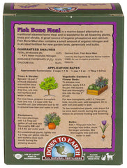Dusting soil with Down To Earth Fish Bone Meal for slow-release nutrients