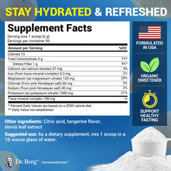 Dr. Berg Hydration Tangerine mix in a glass for refreshing hydration.