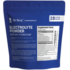 Dr. Berg Sugar-Free Electrolyte Powder Packets dissolving in water for fast hydration.