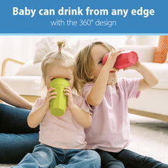 Toddler grips the 360 cup with small hands for easy learning