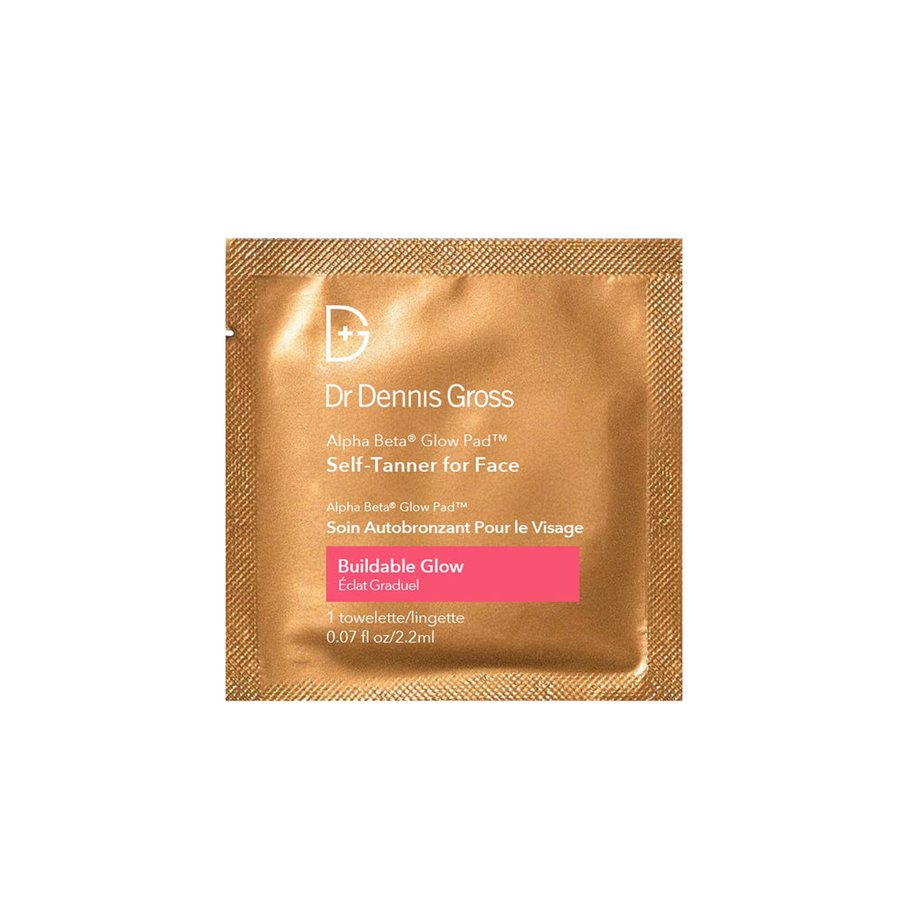 Close-up of Dr Dennis Gross Glow Pad towelettes exfoliating to smooth skin texture.