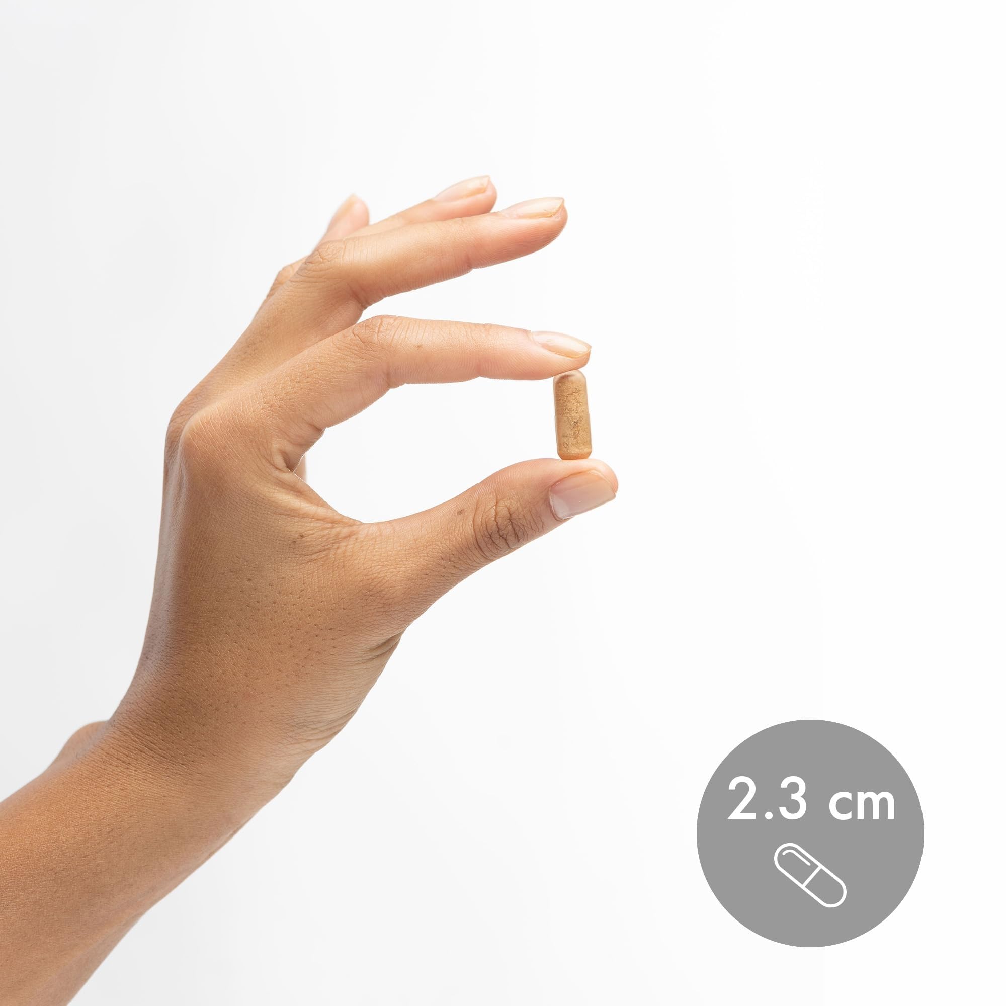 Dr. Mercola capsules in hand suggest easy, gluten-free supplement format.