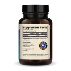 Glass of water with Dr. Mercola H2 tablet ready to drink for daily use