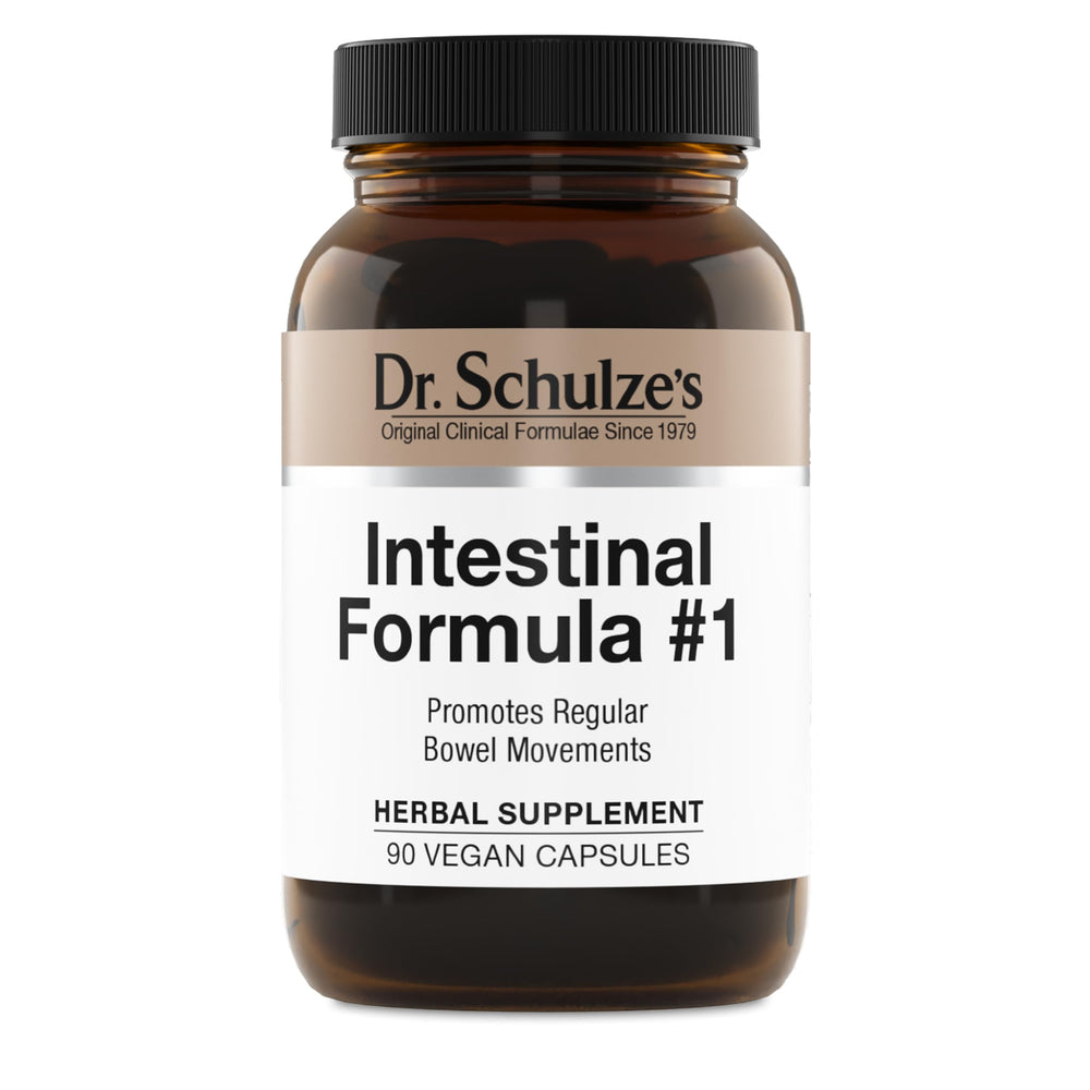 Dr. Schulze's Intestinal Formula #1 bottle shown on a table, plant-based digestion support.