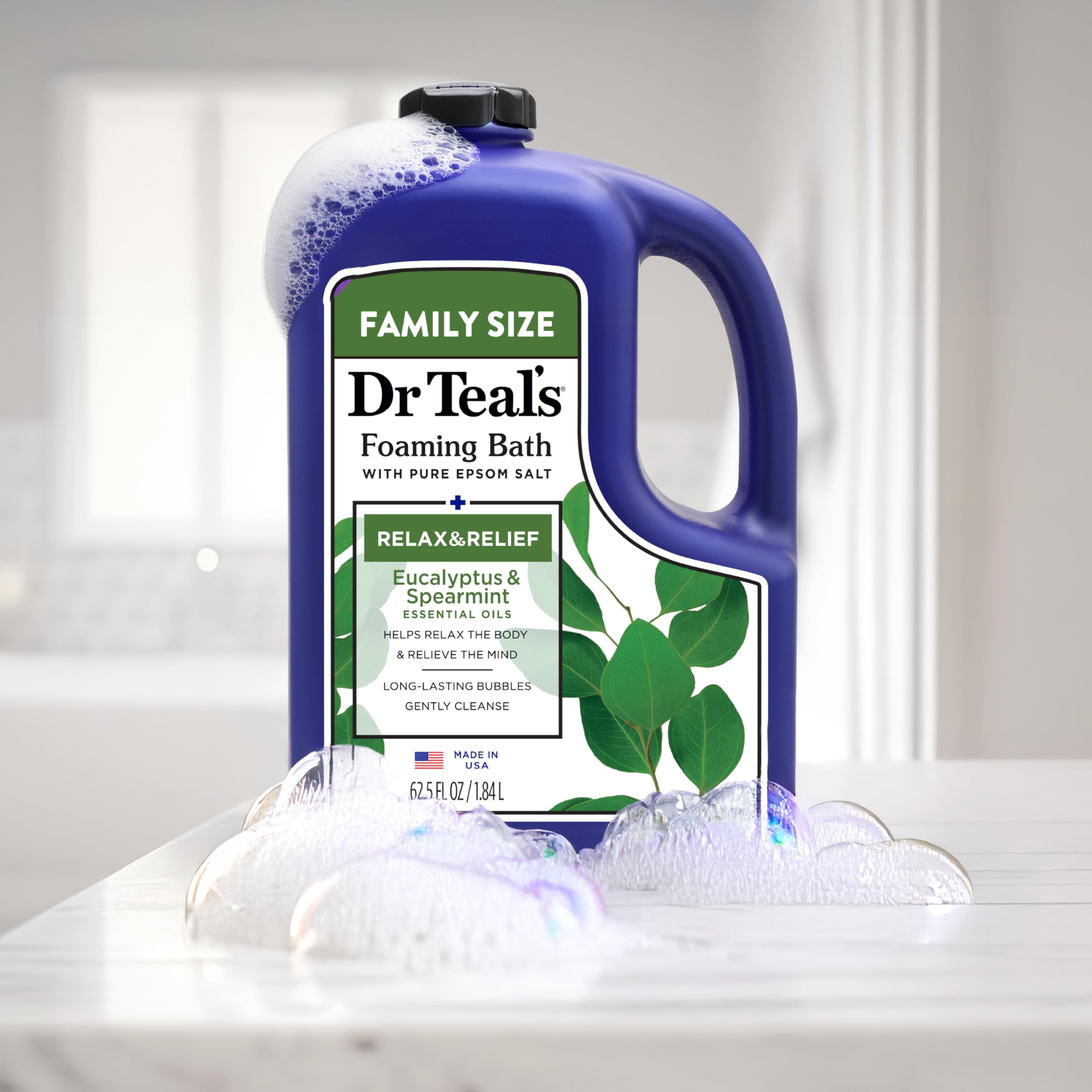 Eucalyptus leaves beside Dr Teal's foaming bath bottle.