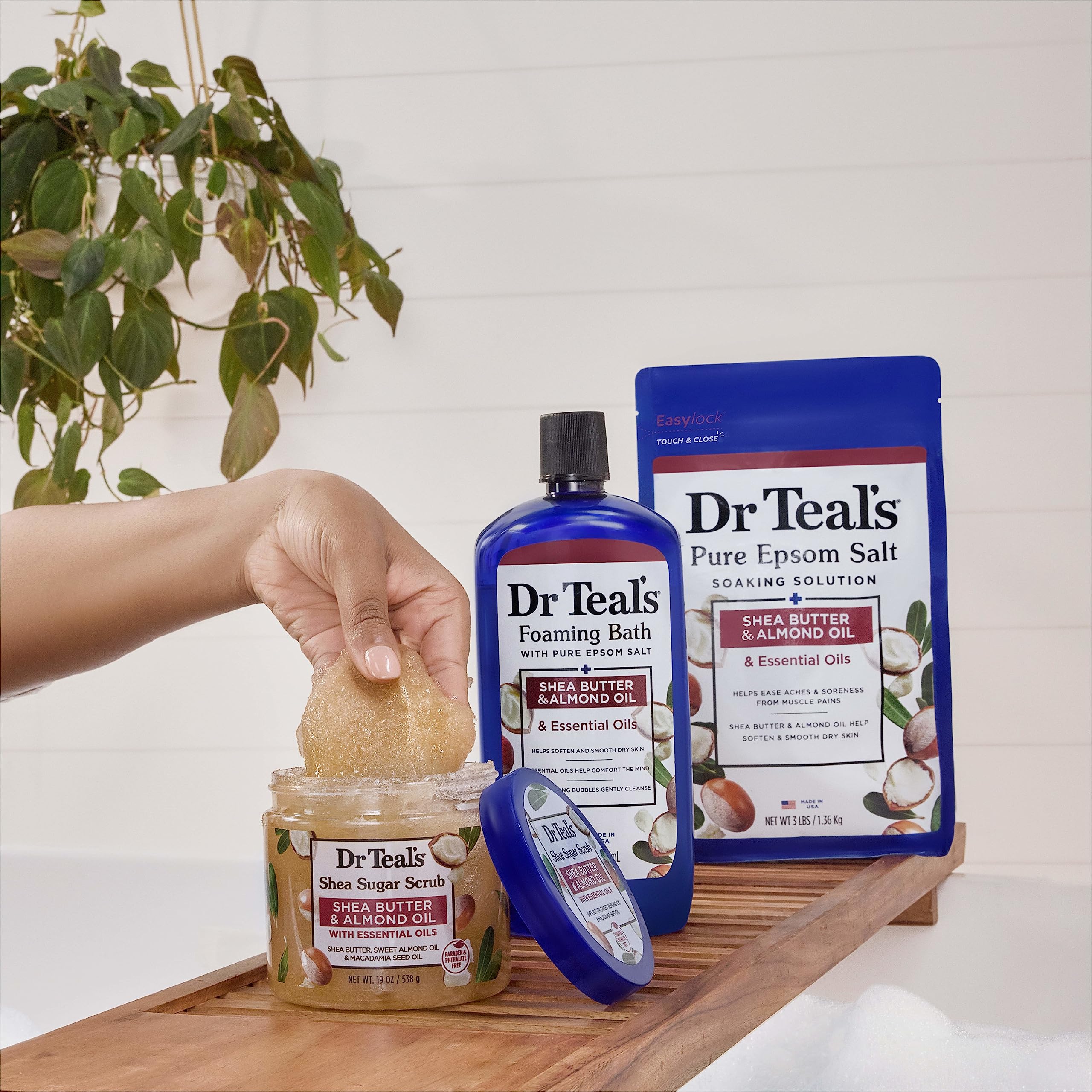 Close-up of exfoliation beads in Dr Teal's scrub in motion.