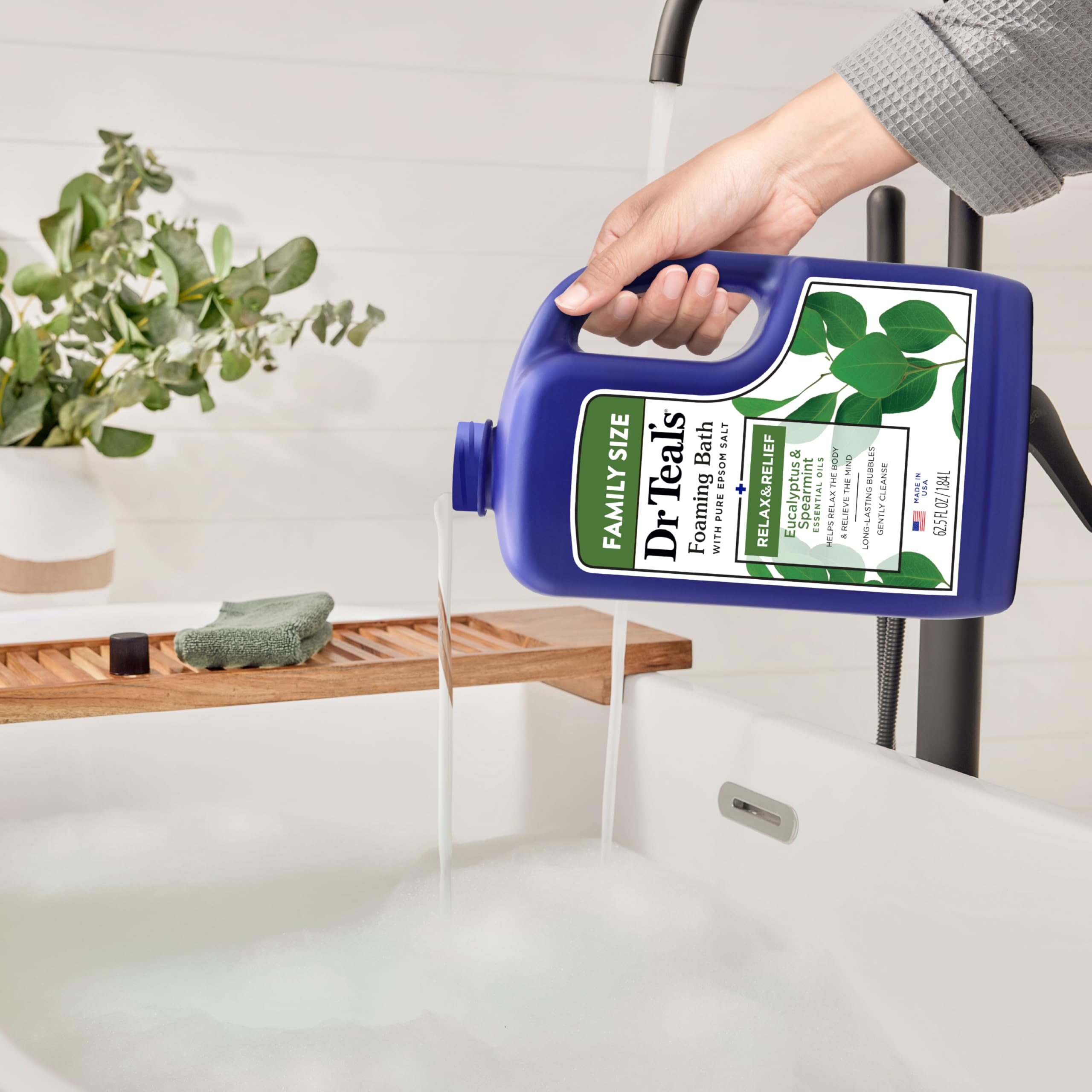 Spearmint leaves beside Dr Teal's foaming bath aroma.