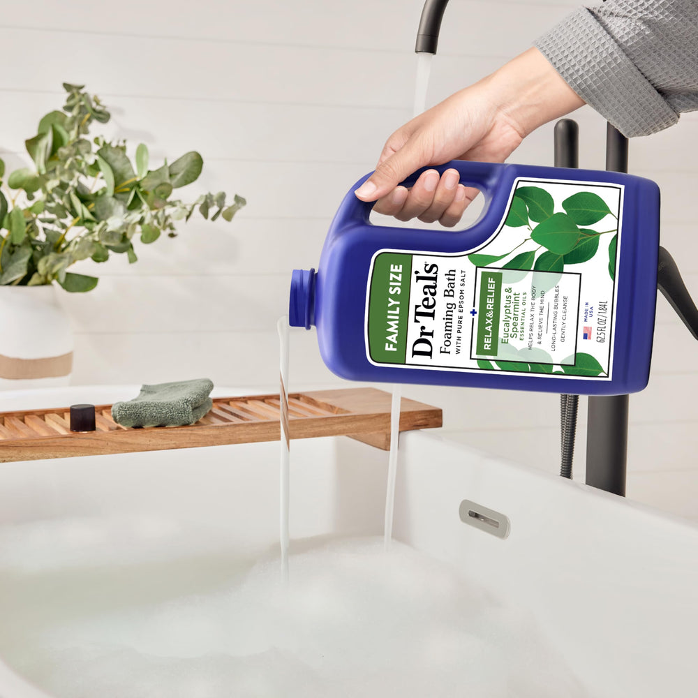 Spearmint leaves beside Dr Teal's foaming bath aroma.