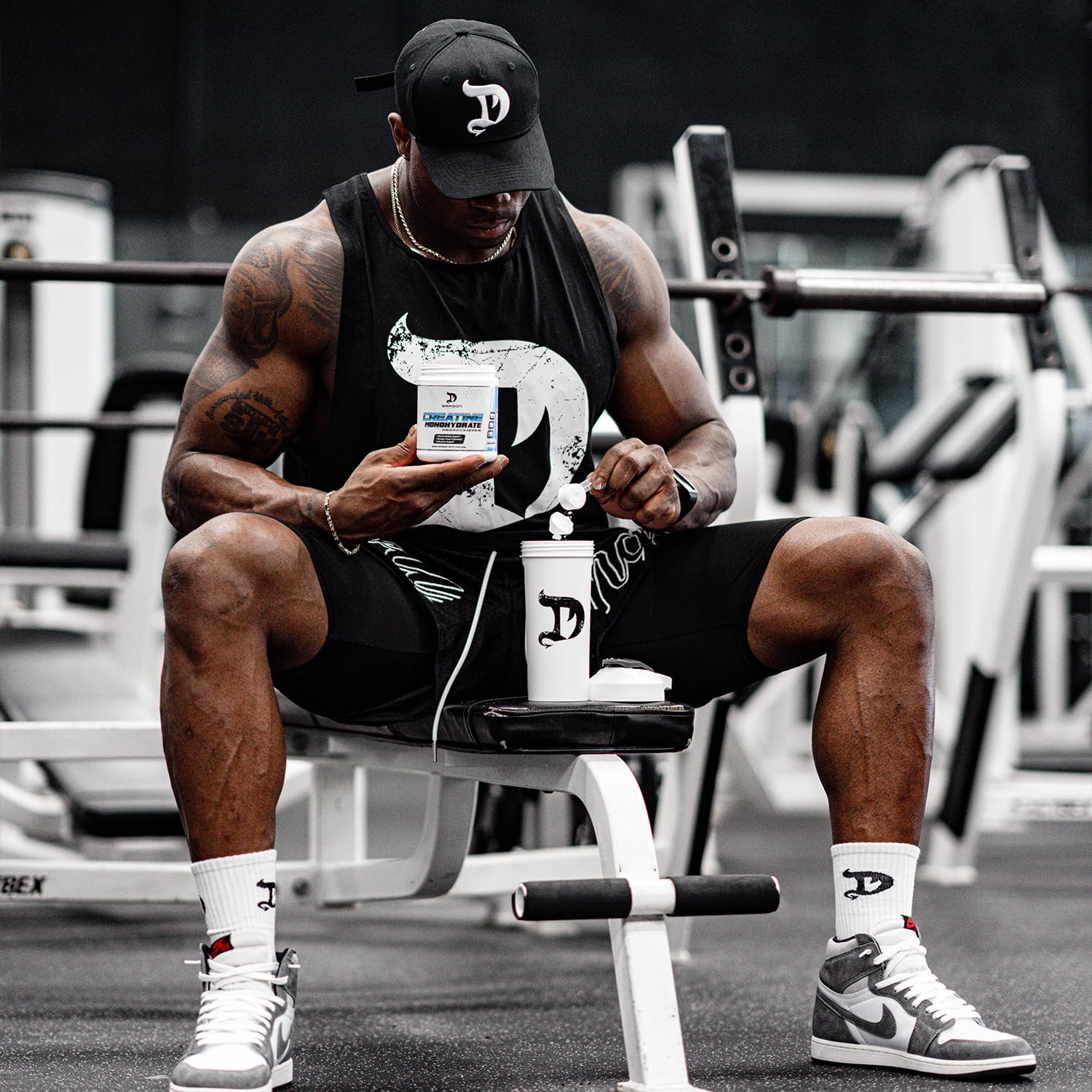 Dragon Pharma Creatine Monohydrate label and scoop pairing suggests athletic performance support.