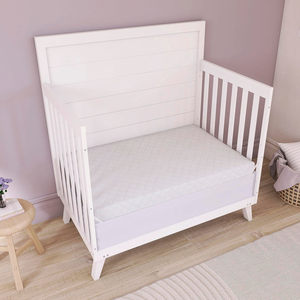 Dream On Me Holly 38x24x3 mini crib mattress fits snugly.