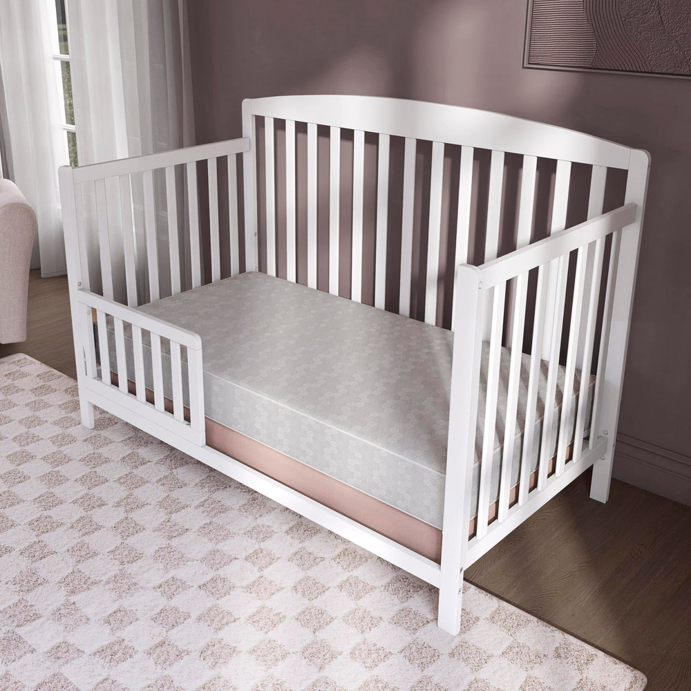 Dream On Me Honeycomb orthopedic mattress side view showing dual-sided design for growth