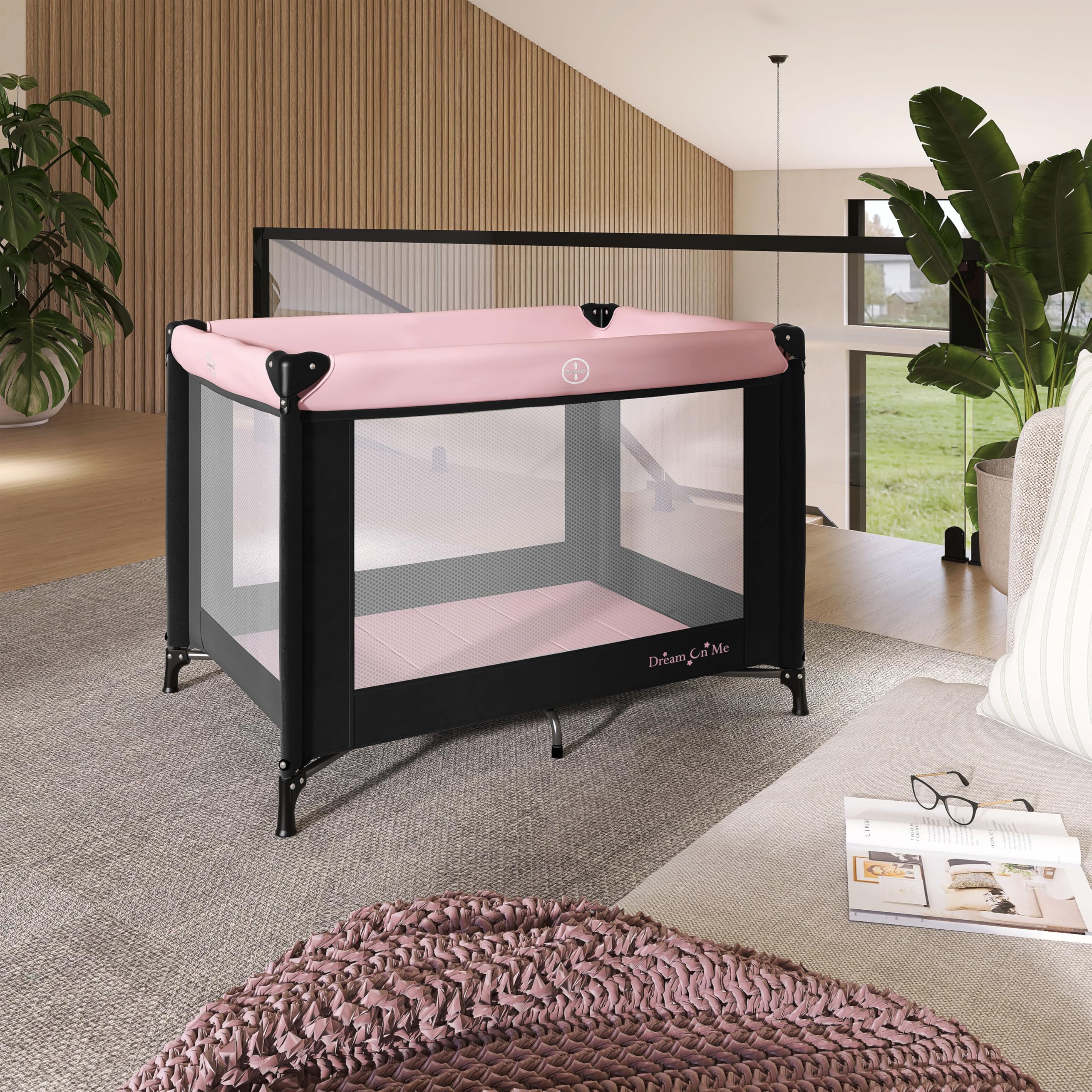 Dream On Me Nest portable playard with mesh sides for 360-degree ventilation and visibility.