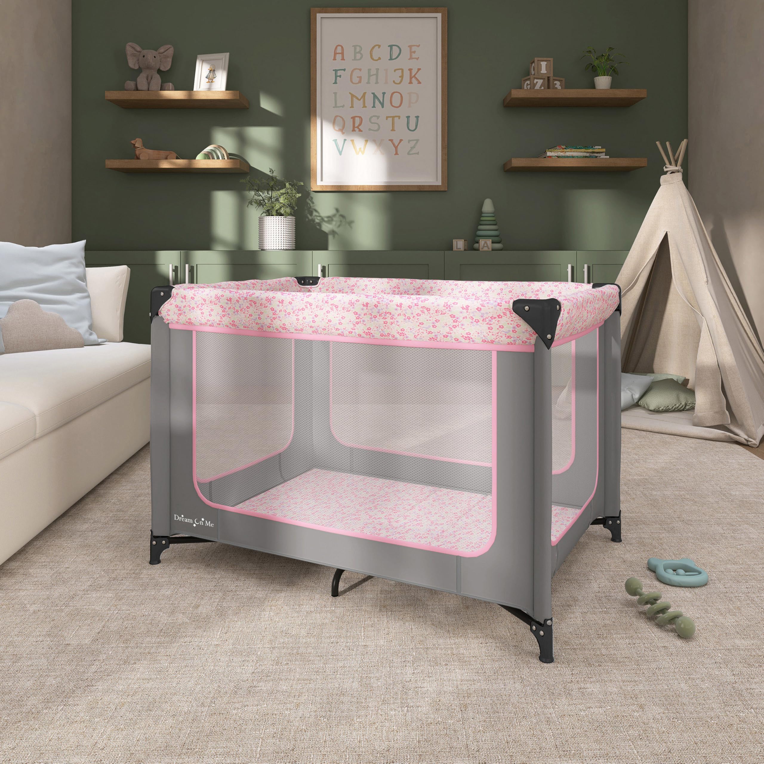 Dream On Me Zodiak playard offers a padded mattress for comfy naps