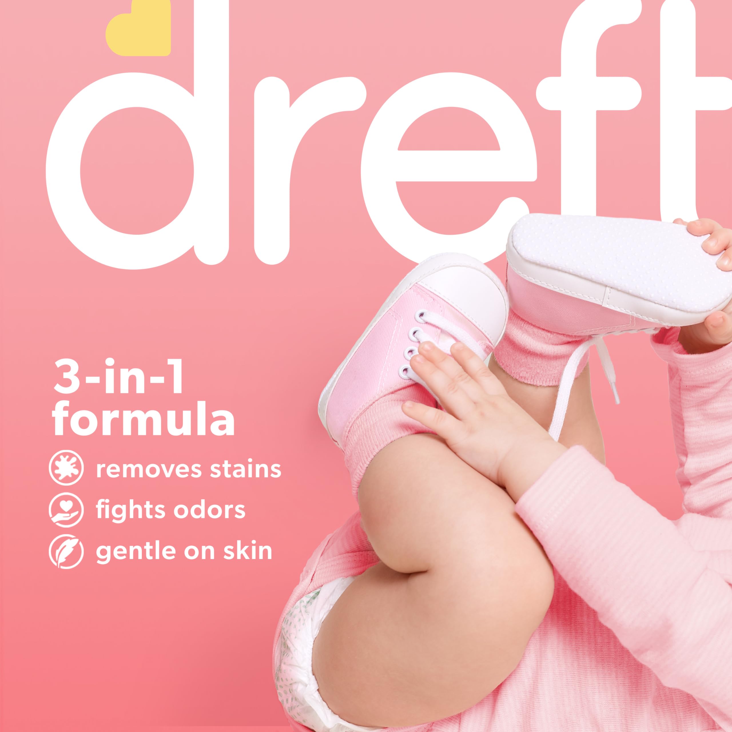 Dreft Stage 1 newborn onesie being washed for stain removal.