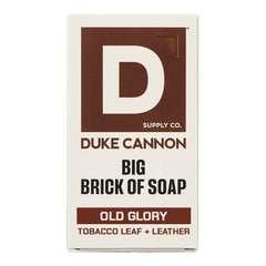 Duke Cannon Old Glory soap bar with leather and tobacco scent for long-lasting cleansing.