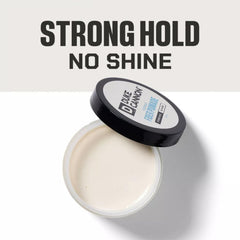 Cap close-up on Duke Cannon pomade demonstrates easy scoop and washout