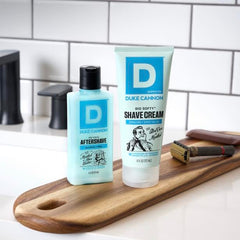 Man applying Duke Cannon Ice Cold Balm for instant comfort after shave
