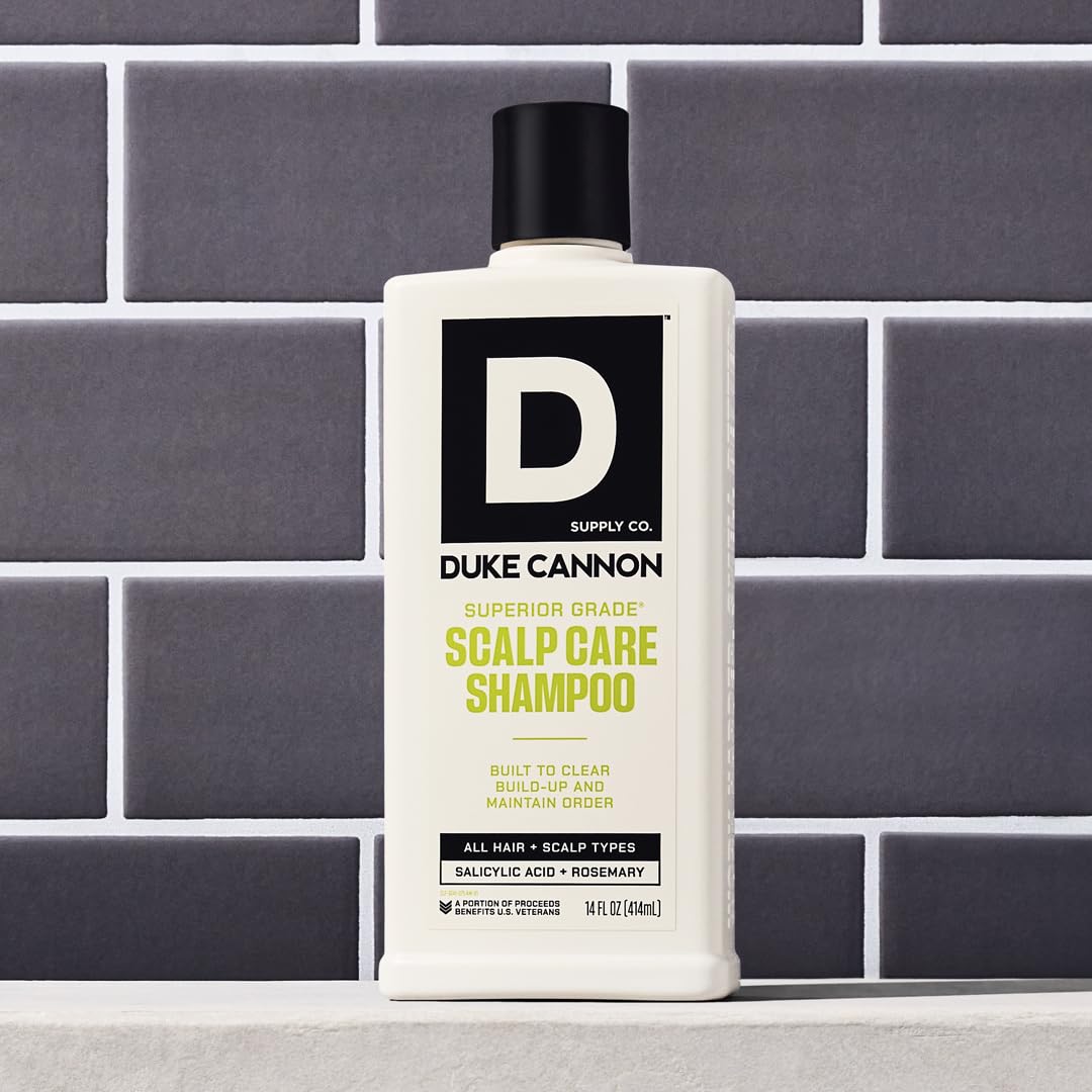 Duke Cannon rosemary-arnica close-up illustrates soothing scalp care and natural extracts.