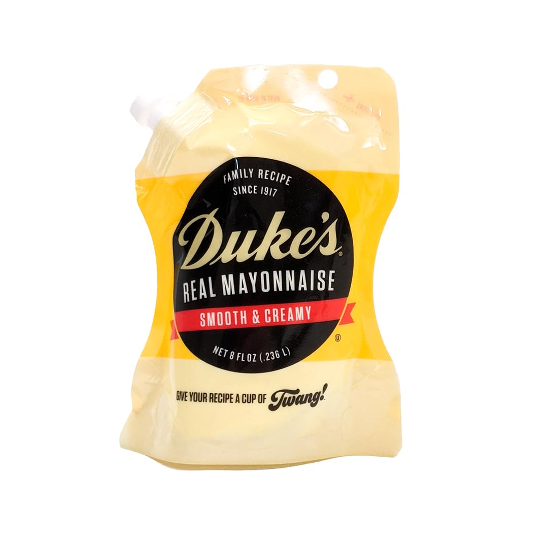 Duke’s Real Mayonnaise pouch pours smoothly, highlighting its creamy texture for sandwiches.