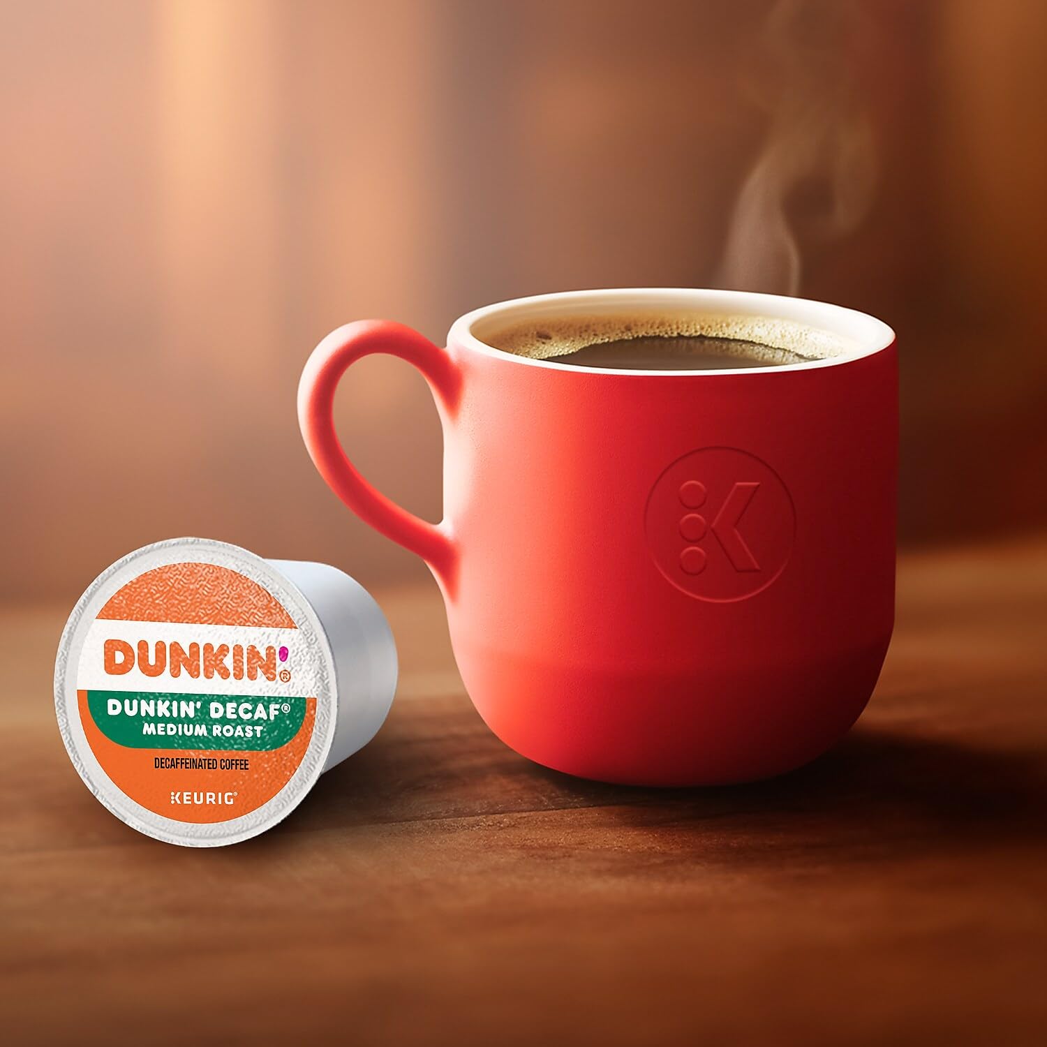 Dunkin' Donuts decaf K-Cup next to a Keurig setup for simple brewing