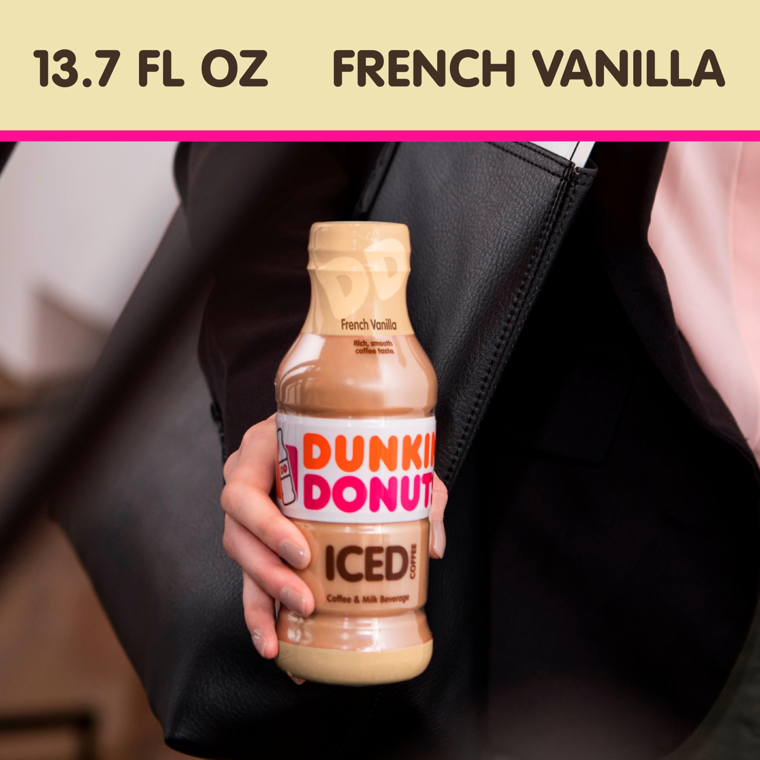 Dunkin' Iced coffee glass with bottle, smooth coffee-milk blend ready to sip.