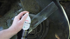 DuPont Non-Stick spray on a kitchen hinge for easier movement and reduced sticking.