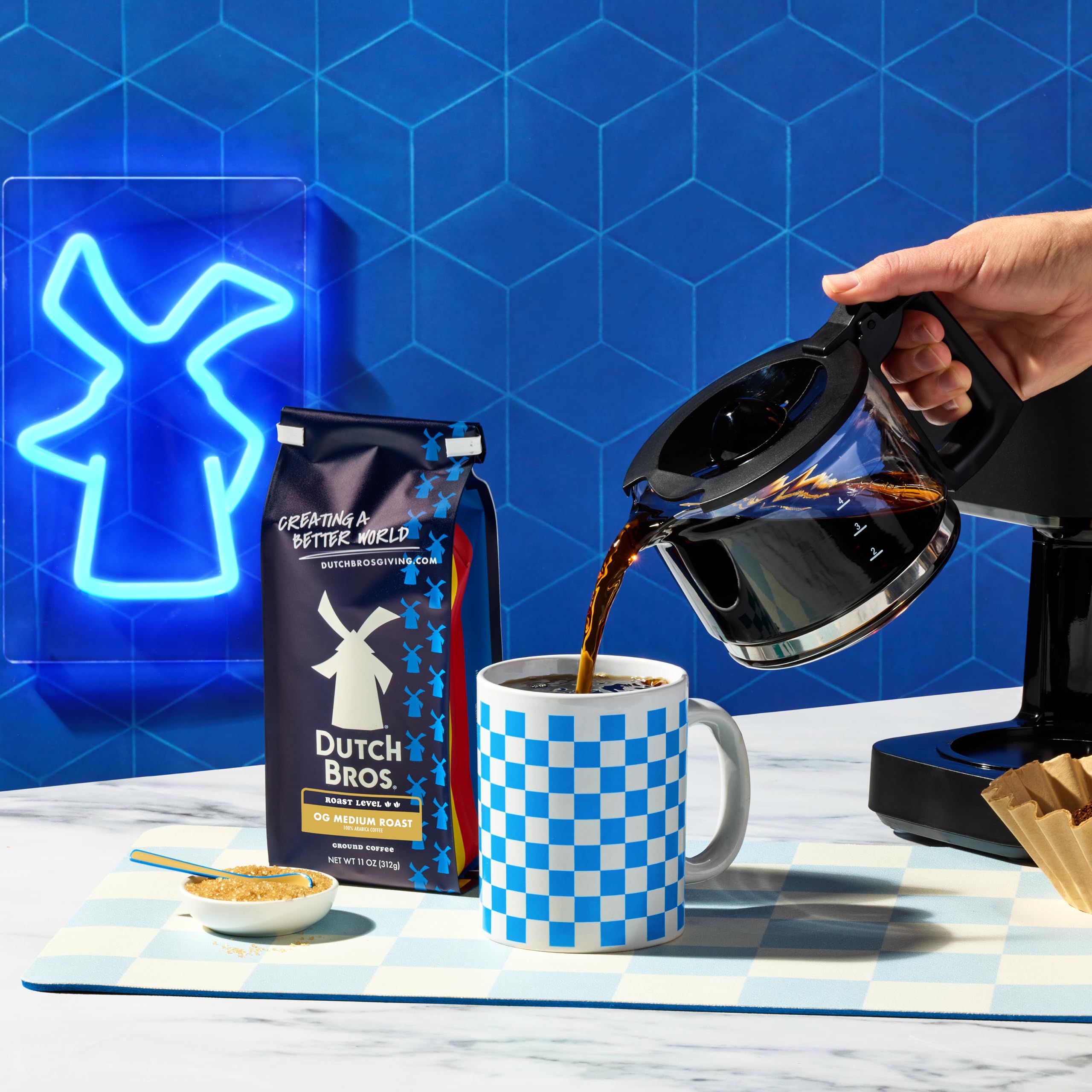 Dutch Bros OG Medium Roast cup steaming with inviting citrus and chocolate aroma.