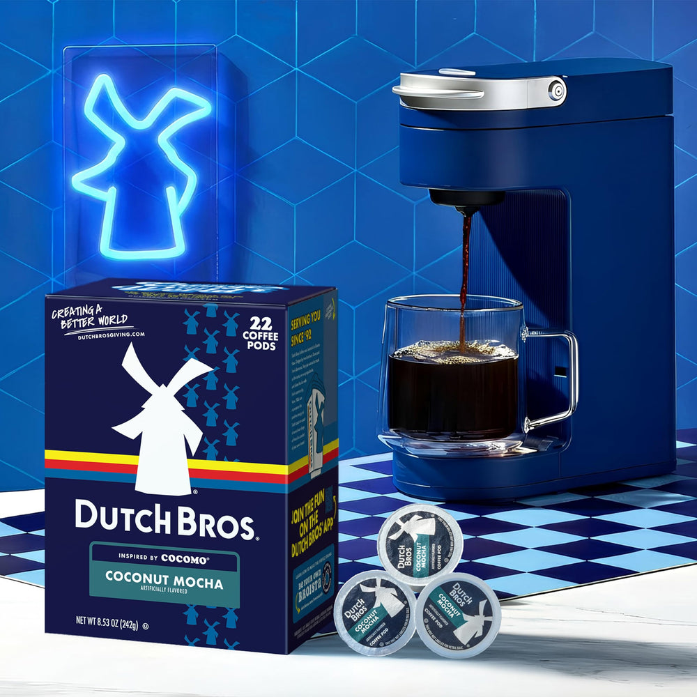 Pod resting on a Keurig machine ready to brew Dutch Bros Coconut Mocha.