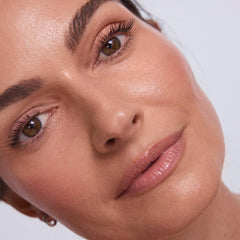 EarthsCure Glow Trio blush-stick swatch on cheek for subtle glow.