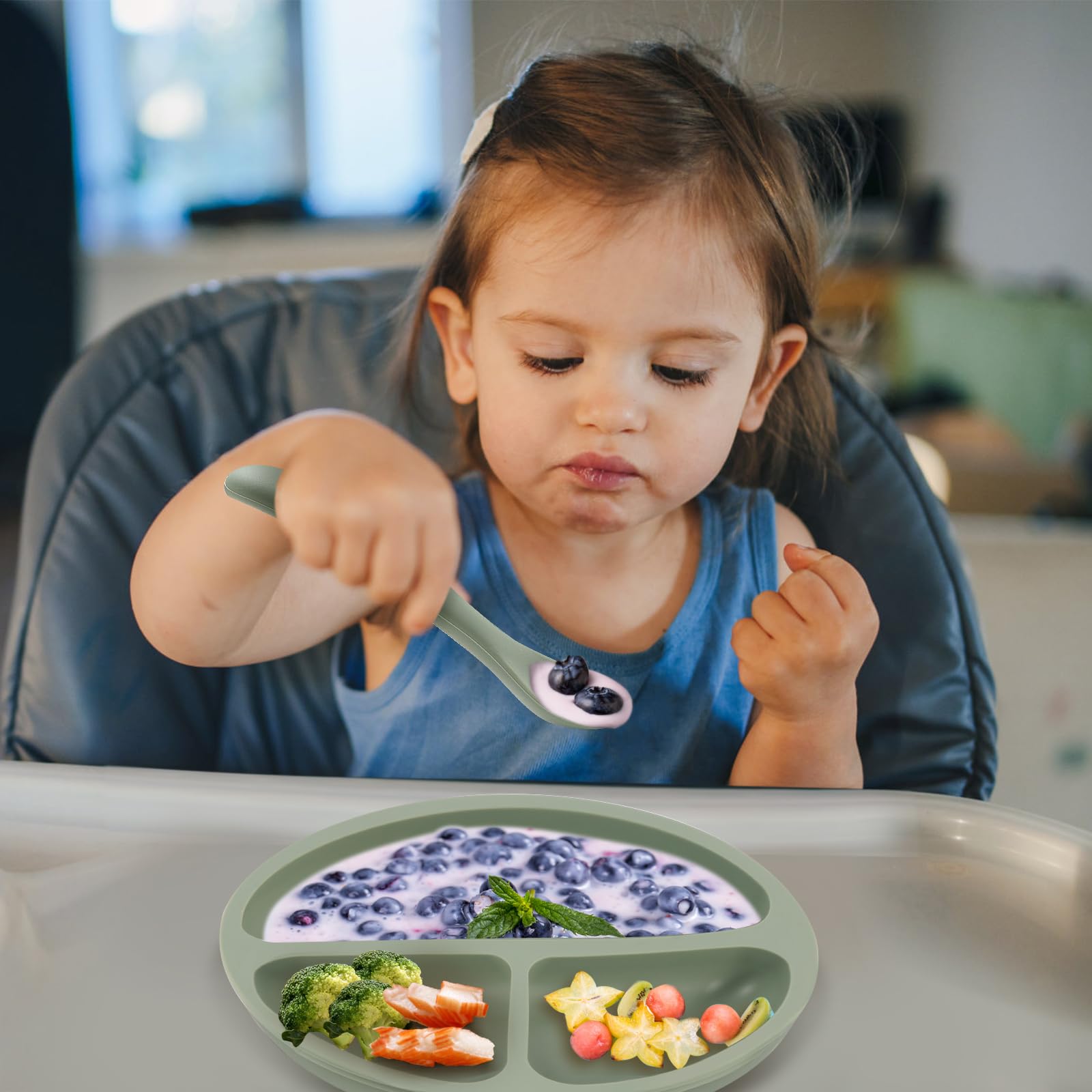 Eascrozn spoon in use by toddler during meals.