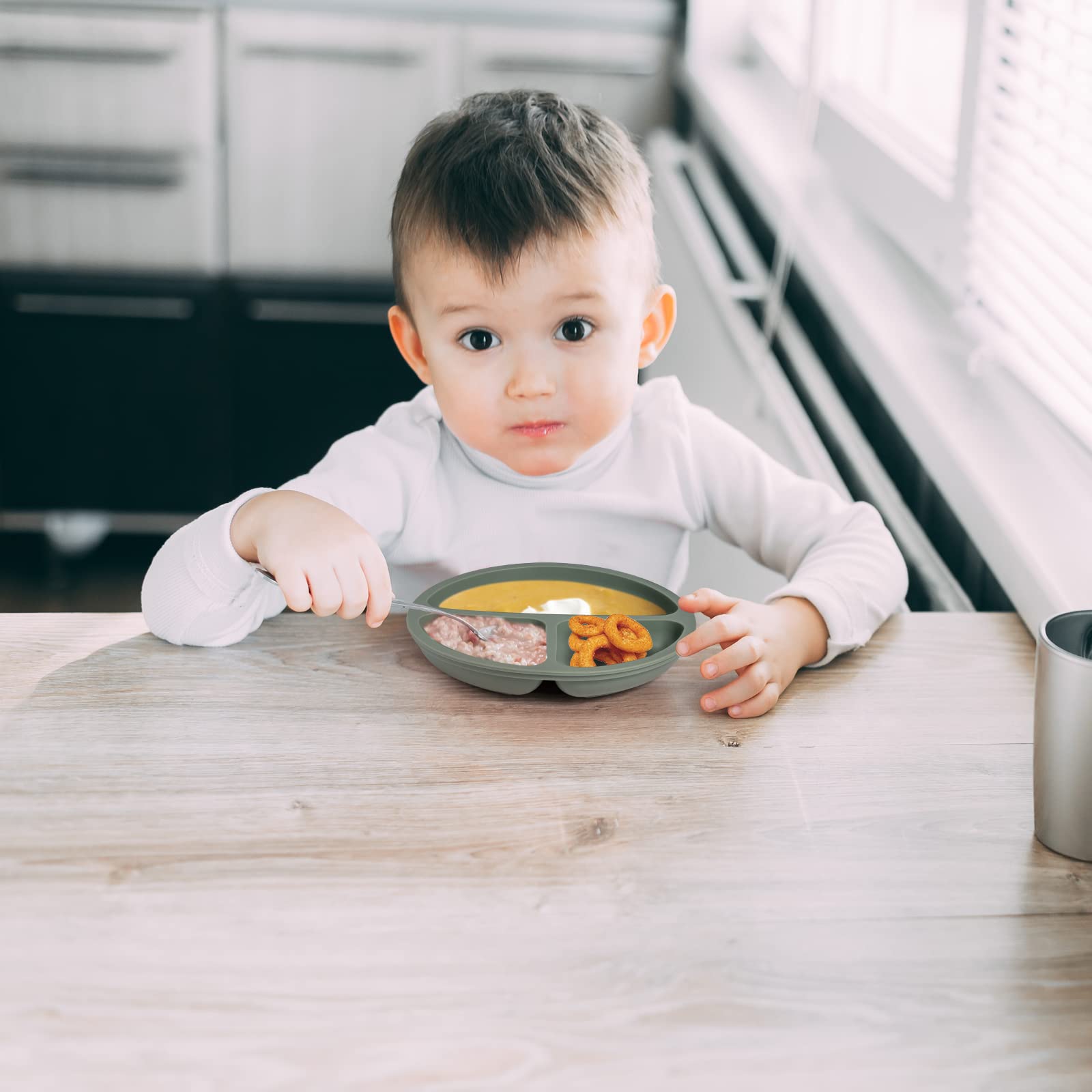 Eascrozn divided silicone baby plate keeps foods neatly separated for easy self-feeding.