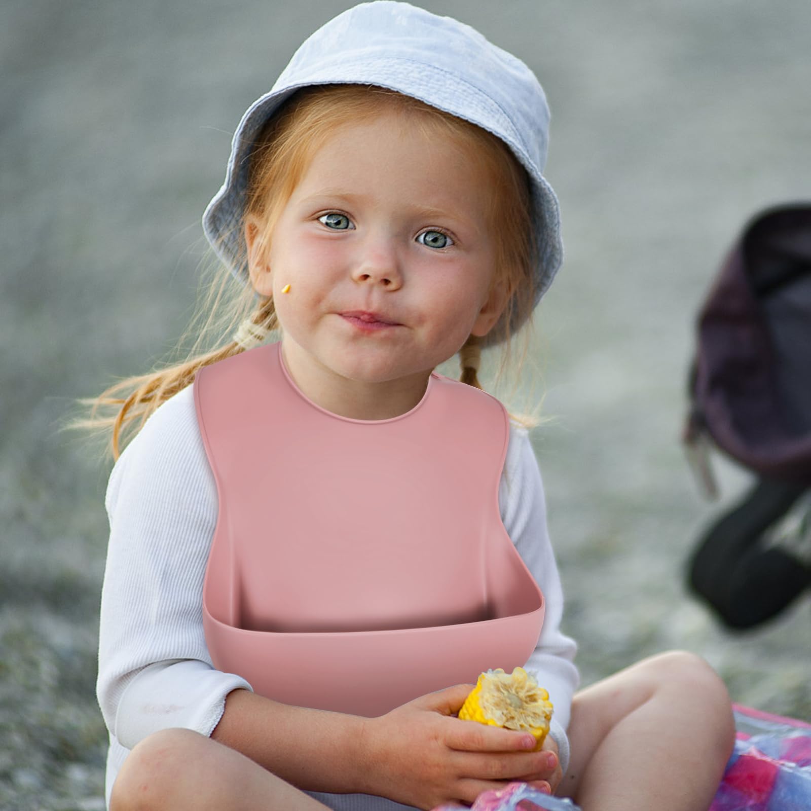 Sturdy pocket catches spills and crumbs, reducing stains on clothing.