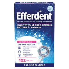 Efferdent Complete Clean tablet dissolving in water for daily sanitization.