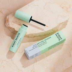 Eight Saints Batting Season serum application near the eye demonstrates easy-to-use formula.