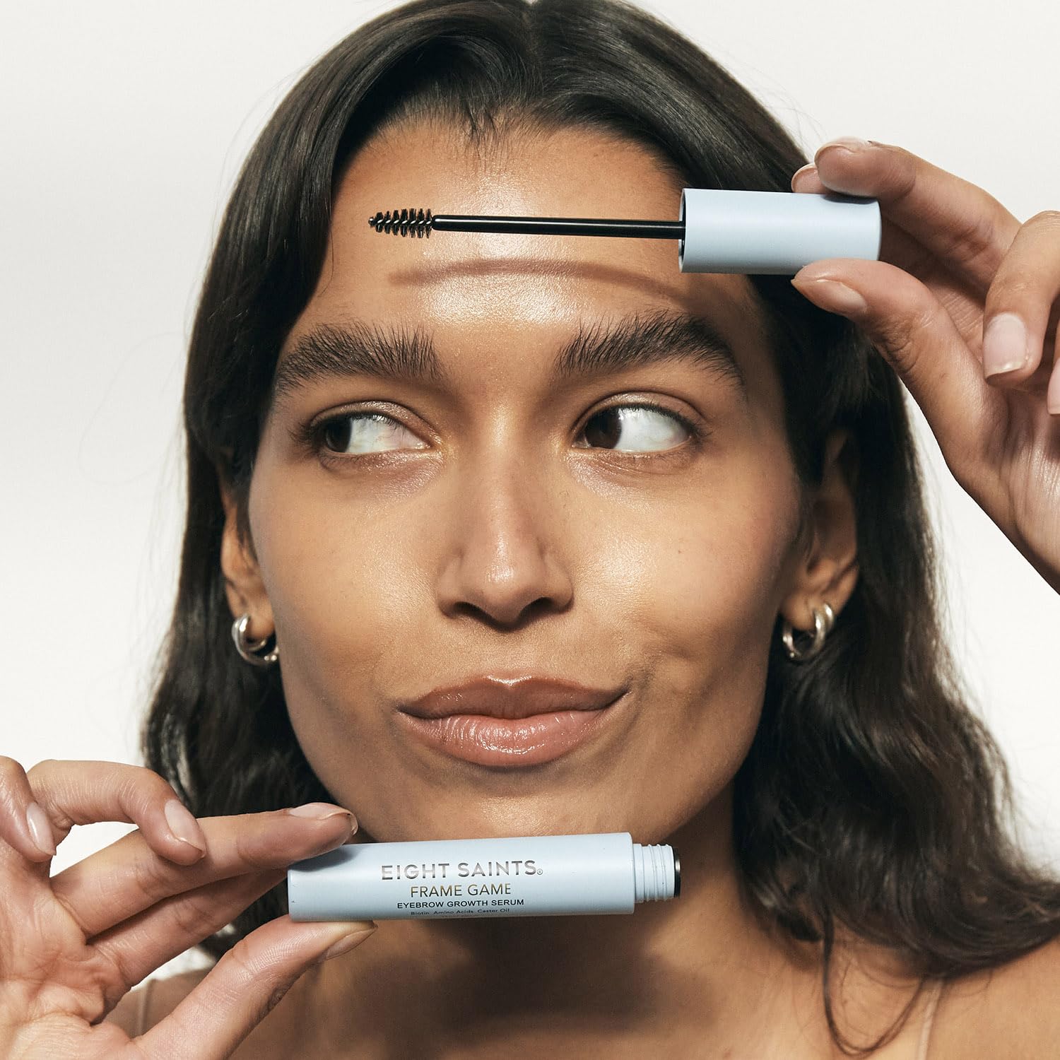 Eight Saints Frame Game brow serum brush application demonstrates easy daily routine for fuller brows